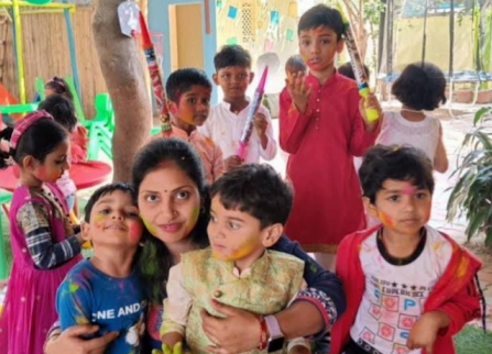 Bright and colorful Holi-themed bulletin board with festive decorations and traditional elements.